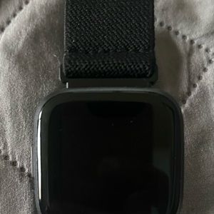 Fit Bit Versa 2 Watch, charger, several bands and 2 screen protectors included.